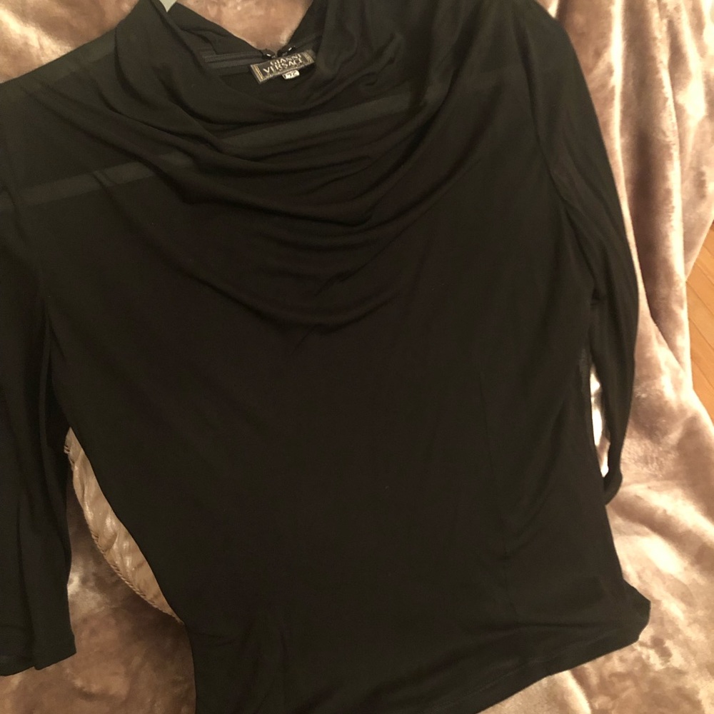 One of the kind Versace black top. Great addition to your outfit. Made in Italy.
